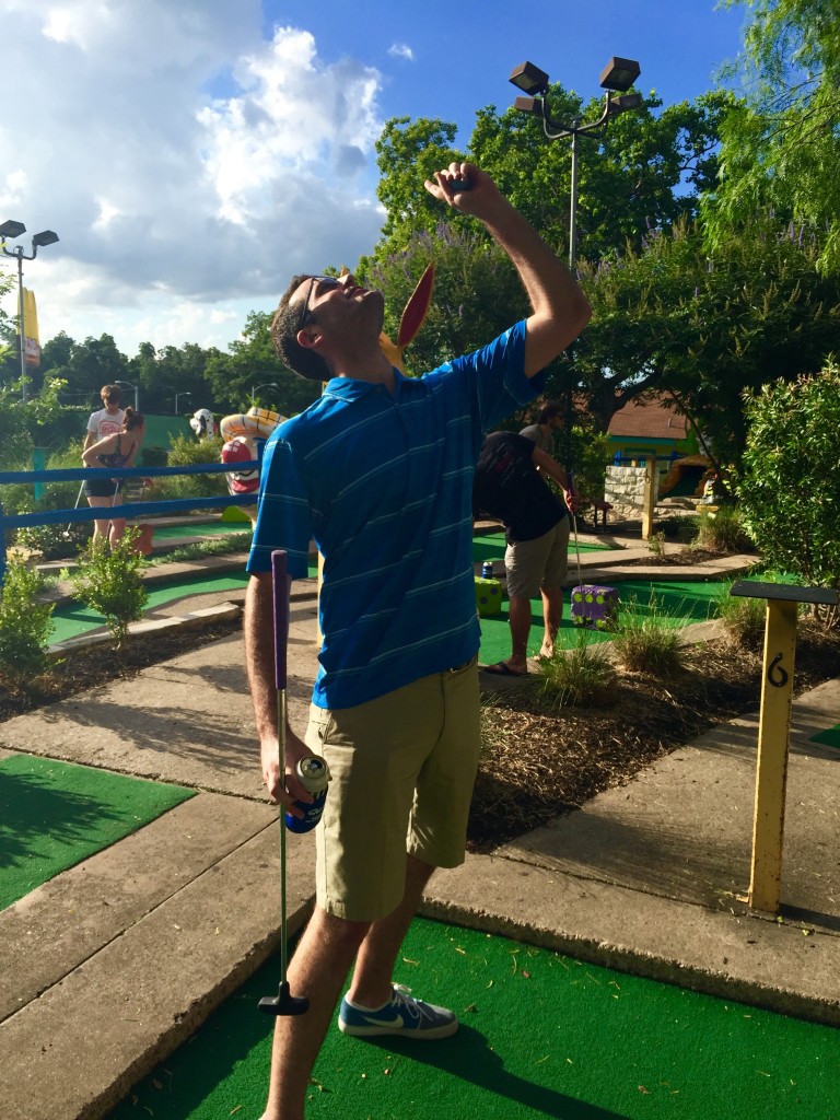 Dan makes a hole in one and celebrates accordingly. 